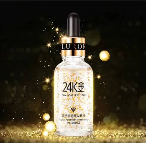 LURION 24K gold skin care essence bottle with dropper on a dark background