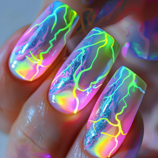 Holographic nail art with neon green, pink, and blue design on a blurred background